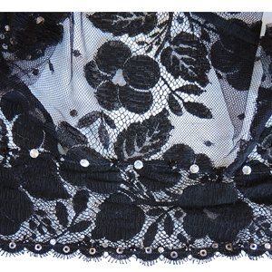 A stunning vintage vest of Chantilly (?) lace embellished with rhineston…